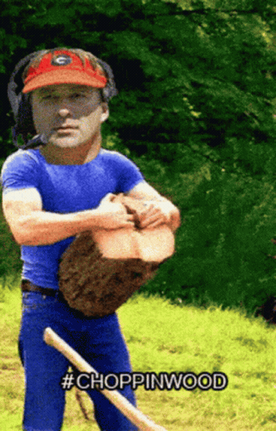 Man In Blue Shirt And Red Hat Holding Tree Stump #Chopinwood GIF
