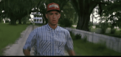 Man In Blue Shirt And Red Hat Running GIF