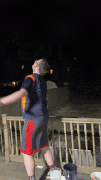 Man In Blue Shirt And Red Shorts GIF