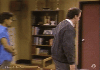Man In Blue Shirt And Red Tank Top Beside Man In Suit GIF