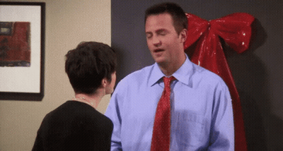 Man In Blue Shirt And Red Tie Standing Next To Woman GIF