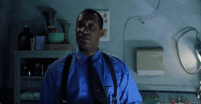 Man In Blue Shirt And Suspenders By Calendar GIF