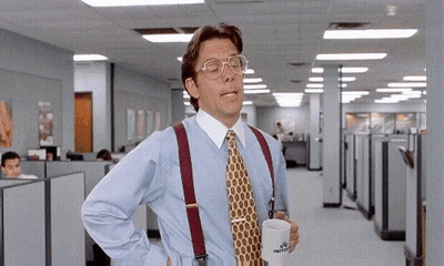 Man In Blue Shirt And Tie Holding Coffee In Office GIF