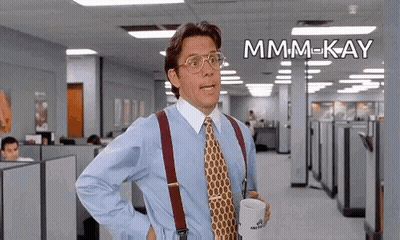Man In Blue Shirt And Tie Holding Coffee GIF