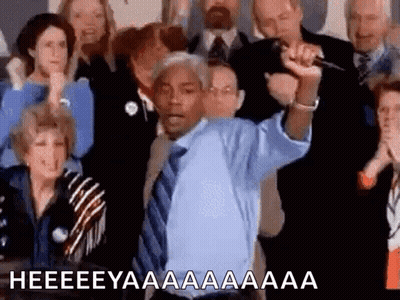 Man In Blue Shirt And Tie Holding Microphone GIF