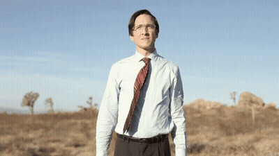 Man In Blue Shirt And Tie In Field GIF
