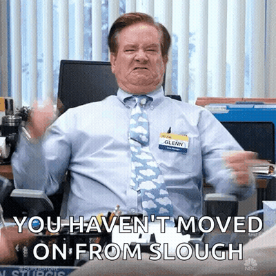 Man In Blue Shirt And Tie Making Face In Office Chair GIF