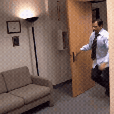Man In Blue Shirt And Tie Opening Door GIF