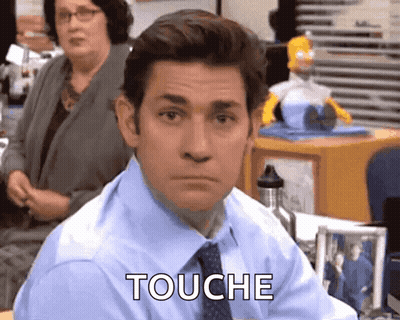 Man In Blue Shirt And Tie Saying Touche GIF