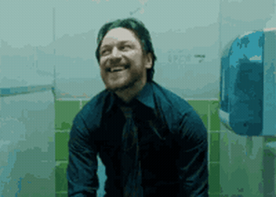 Man In Blue Shirt And Tie Sitting On Toilet Smiling GIF
