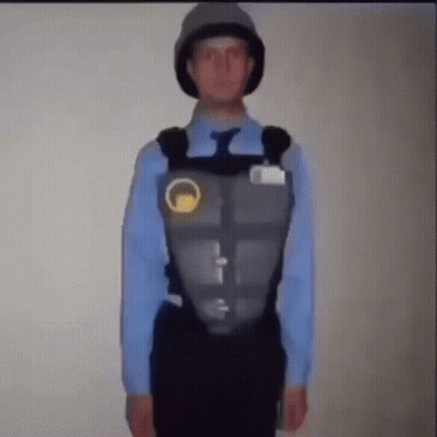 Man In Blue Shirt And Tie With Helmet And Vest GIF