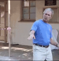 Man In Blue Shirt And White Pants GIF