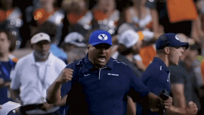 Man In Blue Shirt And White Shorts In Stadium GIF