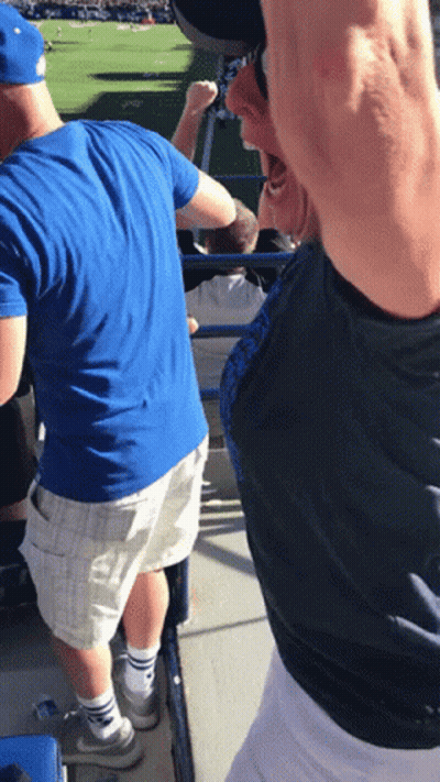 Man In Blue Shirt And White Shorts In Stadium GIF