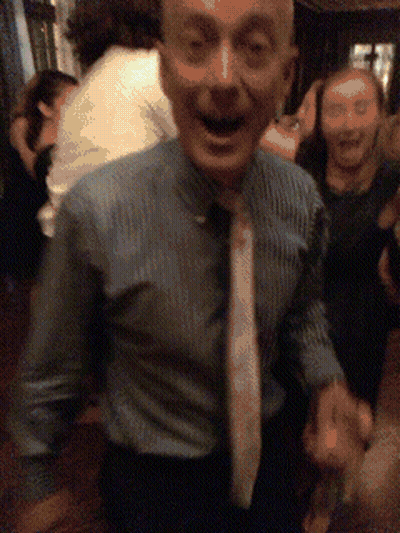 Man In Blue Shirt And White Tie Dancing GIF