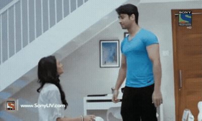 Man In Blue Shirt And Woman In White Shirt With Sony TV Logo GIF