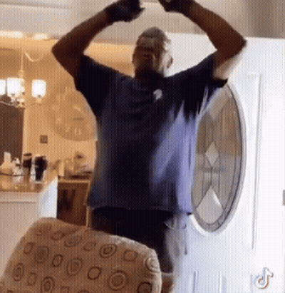 Man In Blue Shirt Arms Outstretched GIF