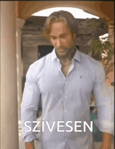 Man In Blue Shirt At Building With Szivesen GIF