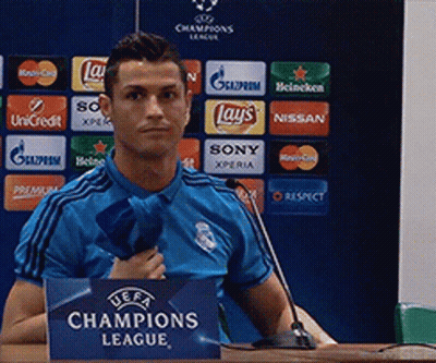 Man In Blue Shirt At Champions League Sign GIF