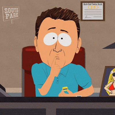 Man In Blue Shirt At Desk In Front Of South Park Sign GIF