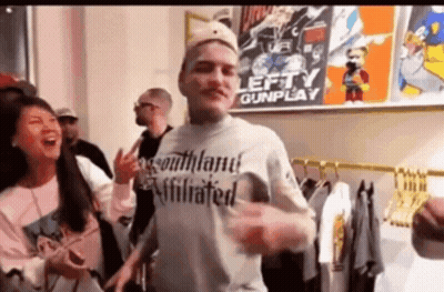 Man In Blue Shirt At Mic Saying To The Left GIF