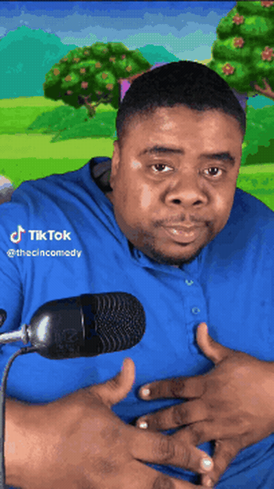 Man In Blue Shirt At Microphone TikTok GIF