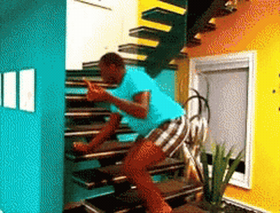 Man In Blue Shirt Climbing Stairs GIF