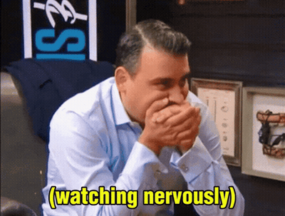 Man In Blue Shirt Covering Mouth GIF