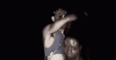 Man In Blue Shirt Dancing In Dark GIF