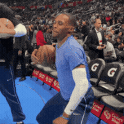 Man In Blue Shirt Dancing In Front Of Crowd GIF