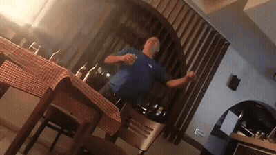 Man In Blue Shirt Dancing In Kitchen GIF