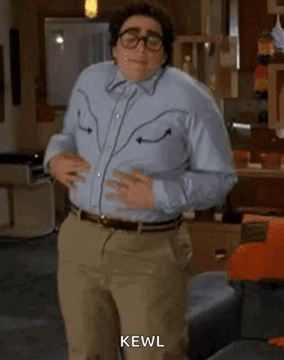 Man In Blue Shirt Dancing In Living Room With Glasses GIF