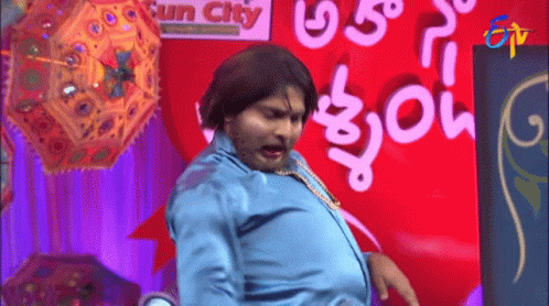 Man In Blue Shirt Dancing In Sun City GIF