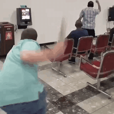 Man In Blue Shirt Dancing In Waiting Room GIF