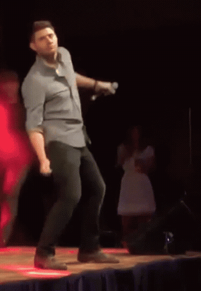 Man In Blue Shirt Dancing On Stage GIF