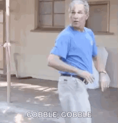 Man In Blue Shirt Dancing Saying Gobble GIF