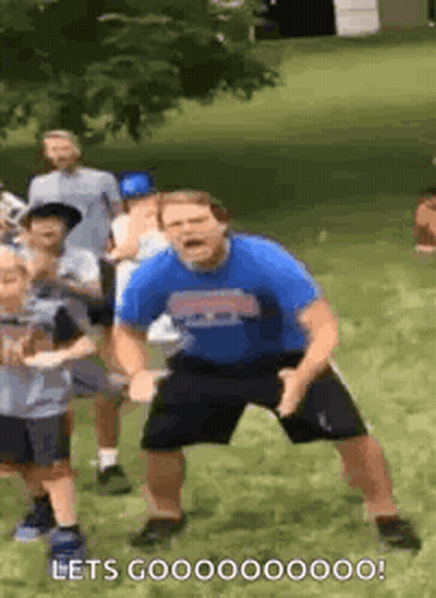 Man In Blue Shirt Dancing With Children GIF