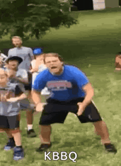 Man In Blue Shirt Dancing With Children GIF