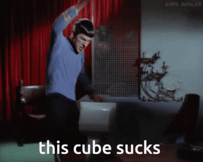 Man In Blue Shirt Dancing With Text This Cube Sucks GIF
