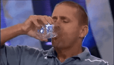 Man In Blue Shirt Drinking From Bottle GIF