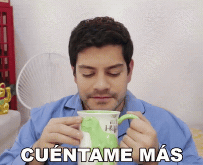 Man In Blue Shirt Drinking From Green Mug Cuentame Mas GIF