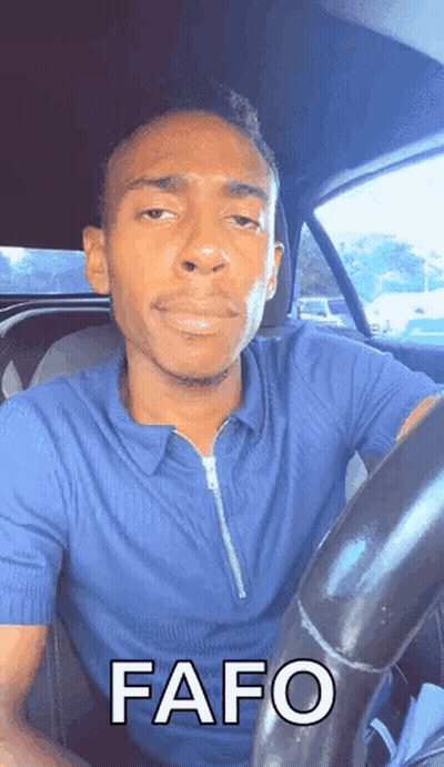 Man In Blue Shirt Driving Car With Funny Face GIF