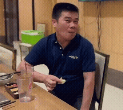 Man In Blue Shirt Eating Food GIF