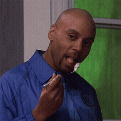Man In Blue Shirt Eating With Tongue Out GIF