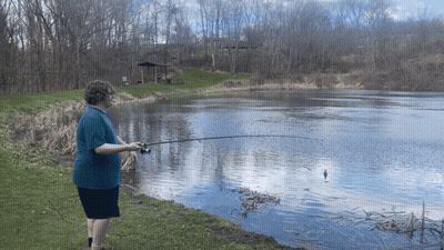 Man In Blue Shirt Fishing GIF