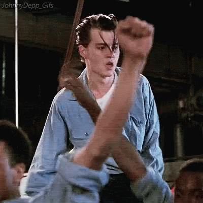 Man In Blue Shirt Fist Up In Air GIF