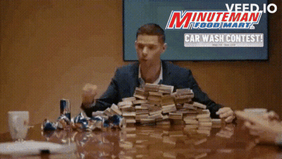 Man In Blue Shirt Flexing Muscles Sitting On Ground GIF