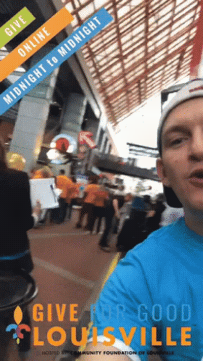 Man In Blue Shirt Give For Good Louisville In Front Of Crowd GIF