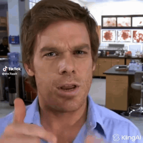 Man in Blue Shirt Giving Thumbs Up
