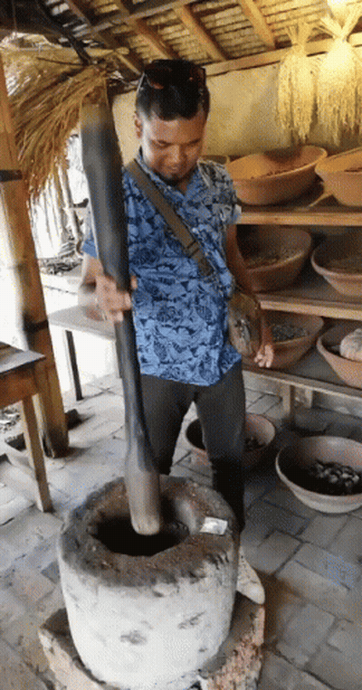 Man In Blue Shirt Grinding With Wooden Stick GIF